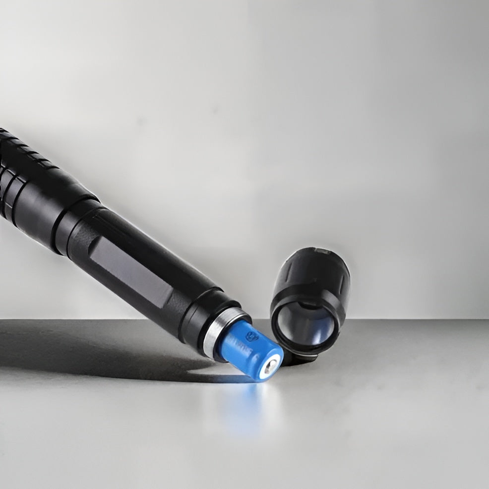 Tactical Flashlight With Integrated Green Laser Sight And Zoomable Beam